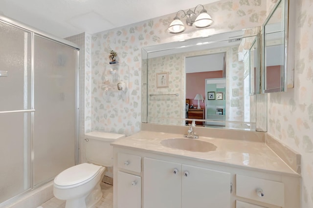 544 Piedmont L, Delray Beach, FL 33484 - ensuite bathroom with connected bathroom, vanity, toilet, wallpapered walls, and a stall shower