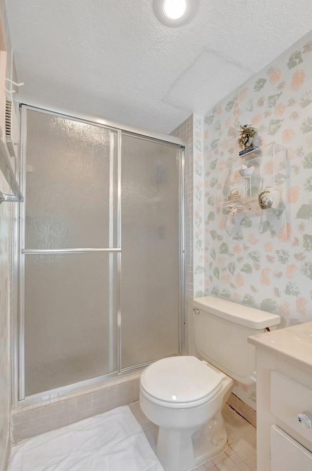544 Piedmont L, Delray Beach, FL 33484 - full bathroom featuring vanity, a shower stall, toilet, and wallpapered walls