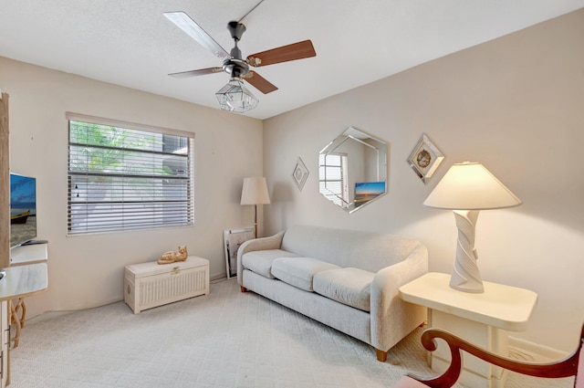544 Piedmont L, Delray Beach, FL 33484 - living room featuring a healthy amount of sunlight, a ceiling fan, and carpet flooring