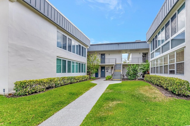 544 Piedmont L, Delray Beach, FL 33484 - view of property's community with a lawn and stairway