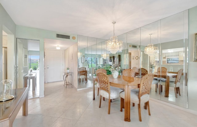 544 Piedmont L, Delray Beach, FL 33484 - dining space featuring a notable chandelier, plenty of natural light, light tile patterned floors, and visible vents