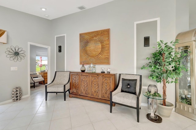 sitting room with baseboards and visible vents