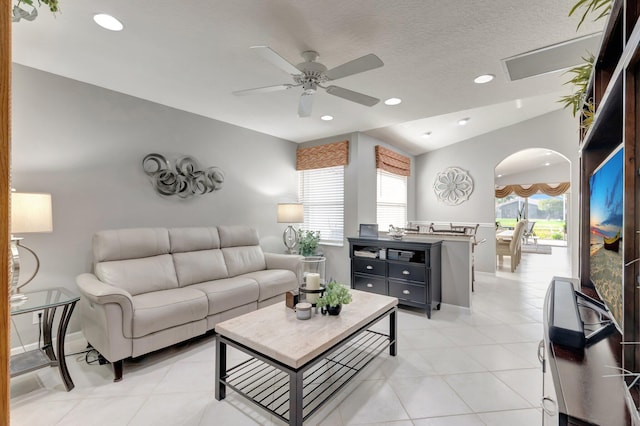 living room featuring recessed lighting, ceiling fan, light tile patterned floors, and vaulted ceiling