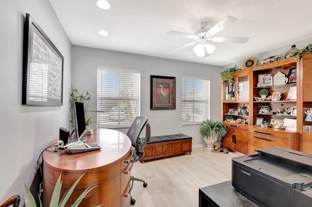 home office with recessed lighting, light wood finished floors, ceiling fan, and baseboards