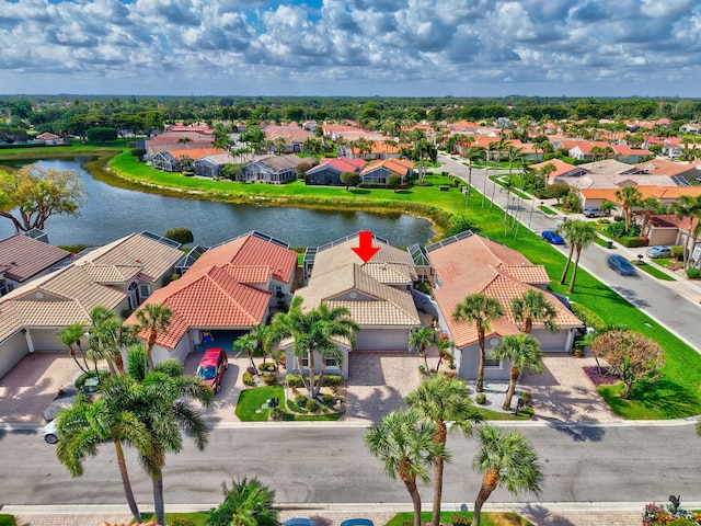 bird's eye view featuring a water view and a residential view