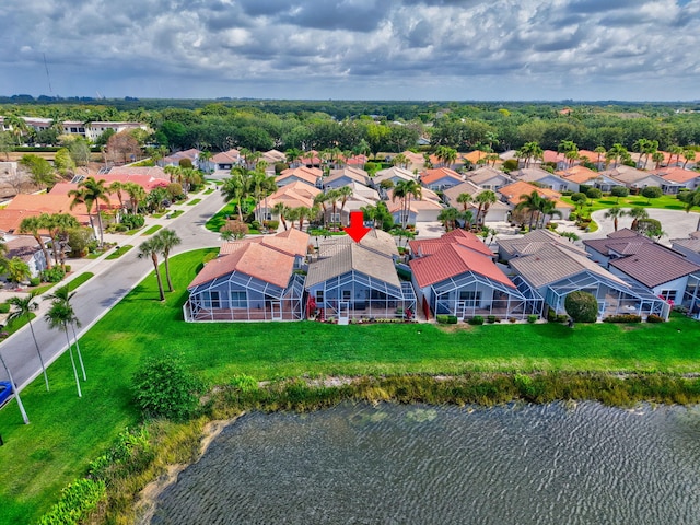 birds eye view of property featuring a residential view and a water view