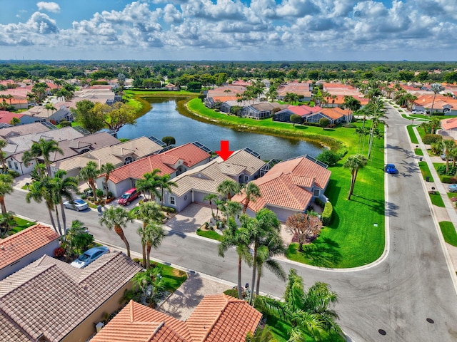 bird's eye view with a water view and a residential view