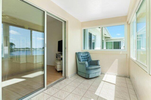 1118 Lake Ter Unit H209, Boynton Beach, FL 33426 - living area with light wood-type flooring, a ceiling fan, and visible vents