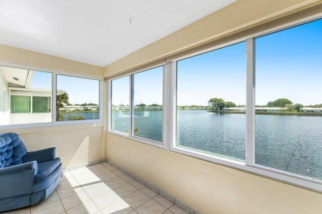 1118 Lake Ter Unit H209, Boynton Beach, FL 33426 - unfurnished sunroom featuring a water view