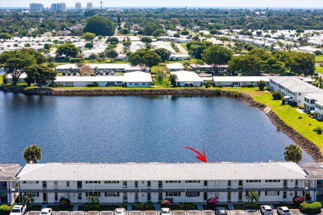 1118 Lake Ter Unit H209, Boynton Beach, FL 33426 - view of property featuring uncovered parking