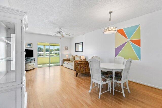 1118 Lake Ter Unit H209, Boynton Beach, FL 33426 - dining area with baseboards and light wood finished floors