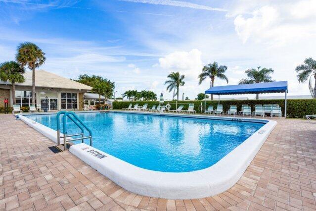 1118 Lake Ter Unit H209, Boynton Beach, FL 33426 - drone / aerial view with a water view
