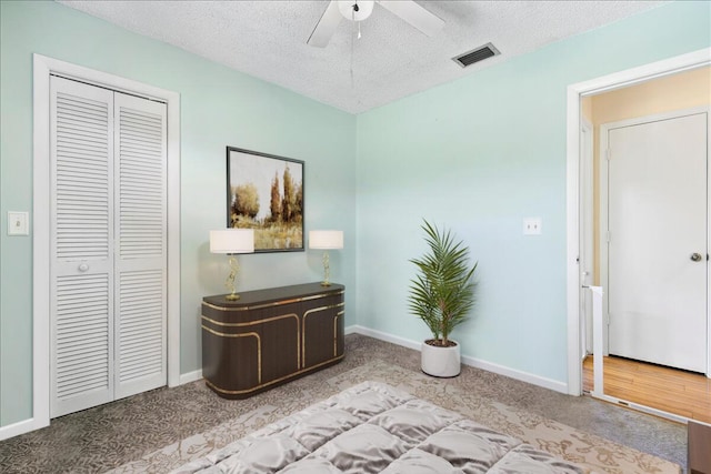 12610 63rd Ln N, The Acreage, FL 33412 - interior space with visible vents, a textured ceiling, baseboards, and ceiling fan