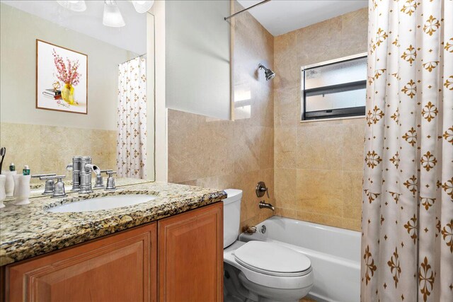 12610 63rd Ln N, The Acreage, FL 33412 - full bathroom with vanity, toilet, tile walls, and shower / tub combo with curtain
