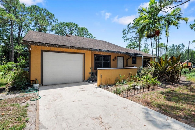 12610 63rd Ln N, The Acreage, FL 33412 - ranch-style home with fence, roof with shingles, stucco siding, an attached garage, and driveway