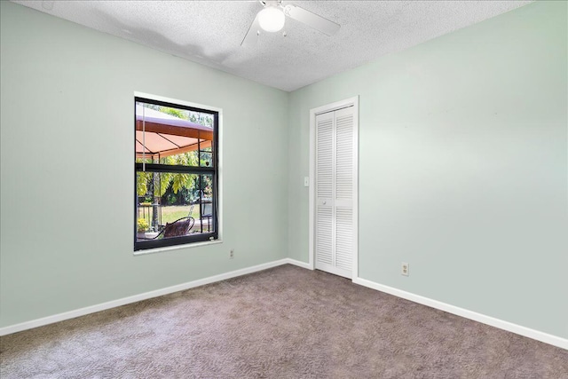 12610 63rd Ln N, The Acreage, FL 33412 - unfurnished bedroom featuring carpet flooring, a textured ceiling, baseboards, and a closet