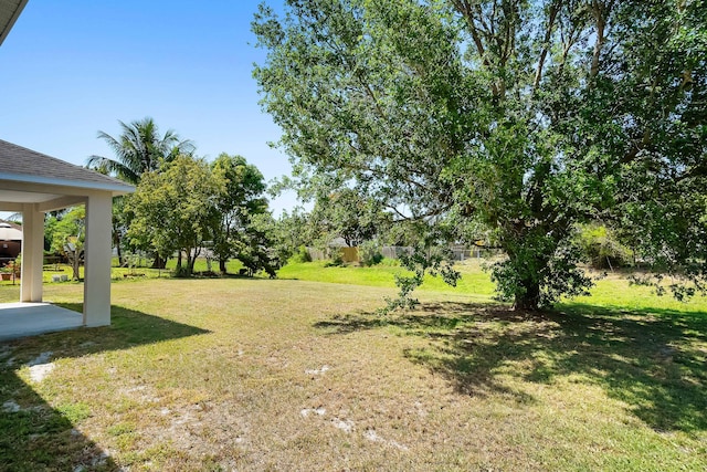 565 SW Feldman Ave N, Port Saint Lucie, FL 34953 - view of yard featuring a patio area