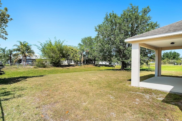565 SW Feldman Ave N, Port Saint Lucie, FL 34953 - view of yard featuring a patio