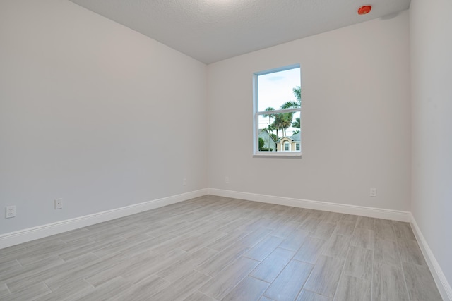 1634 SW Import Dr, Port Saint Lucie, FL 34953 - unfurnished room with baseboards and light wood-type flooring