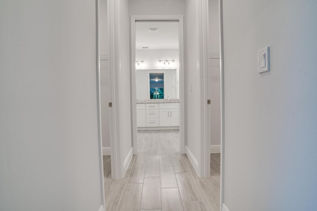 1634 SW Import Dr, Port Saint Lucie, FL 34953 - corridor featuring baseboards and wood tiled floor