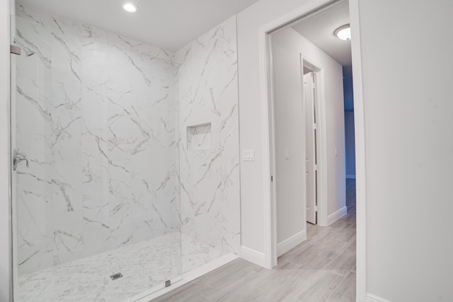 1634 SW Import Dr, Port Saint Lucie, FL 34953 - bathroom featuring a marble finish shower, baseboards, recessed lighting, and wood finished floors