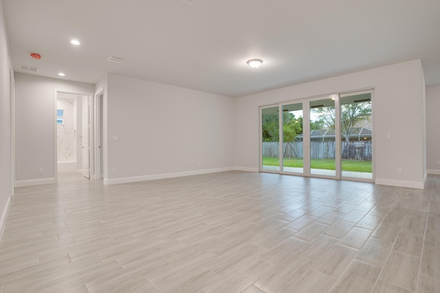 1634 SW Import Dr, Port Saint Lucie, FL 34953 - unfurnished room with baseboards, recessed lighting, light wood-style floors, and visible vents