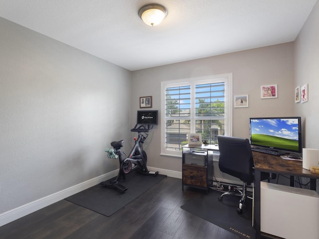 office featuring baseboards and dark wood-style floors