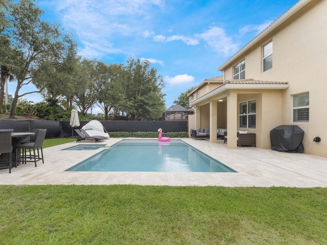 view of pool featuring an outdoor living space, a fenced backyard, a yard, and a patio