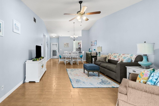 2641 Gately Dr W Unit 103, West Palm Beach, FL 33415 - living room with visible vents, light wood-type flooring, baseboards, high vaulted ceiling, and ceiling fan with notable chandelier
