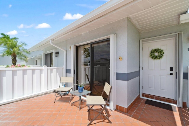 2641 Gately Dr W Unit 103, West Palm Beach, FL 33415 - doorway to property with stucco siding