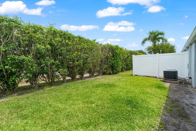 2641 Gately Dr W Unit 103, West Palm Beach, FL 33415 - view of yard with central AC unit and fence