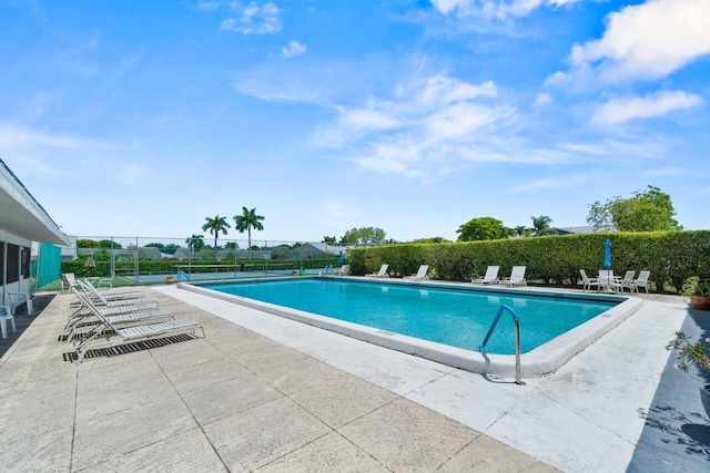 2641 Gately Dr W Unit 103, West Palm Beach, FL 33415 - pool featuring a patio area and fence