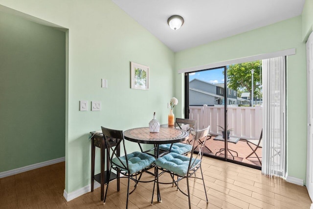2641 Gately Dr W Unit 103, West Palm Beach, FL 33415 - dining area with baseboards and light wood-style floors