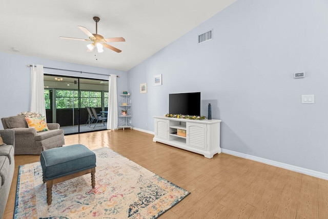 2641 Gately Dr W Unit 103, West Palm Beach, FL 33415 - living room featuring a ceiling fan, visible vents, vaulted ceiling, wood finished floors, and baseboards