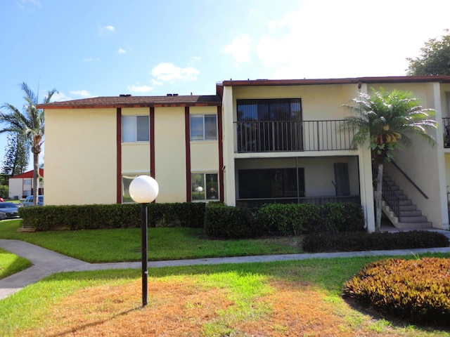 view of property featuring stairway