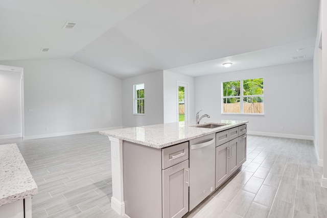 206 SW Voltair Ter, Port Saint Lucie, FL 34984 - kitchen with a sink, dishwasher, baseboards, open floor plan, and gray cabinetry
