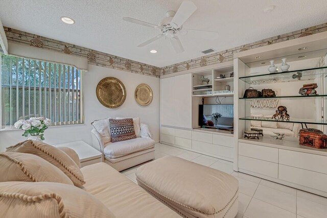 9870 Harbour Lake Cir, Boynton Beach, FL 33437 - living room with ceiling fan, a textured ceiling, visible vents, light tile patterned floors, and recessed lighting