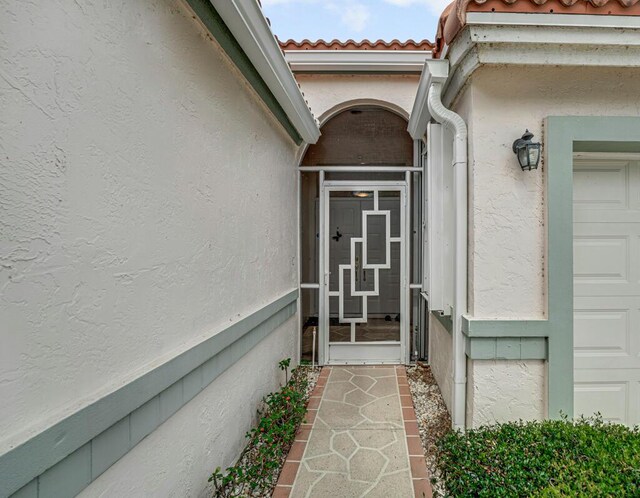 9870 Harbour Lake Cir, Boynton Beach, FL 33437 - entrance to property featuring stucco siding and a tiled roof