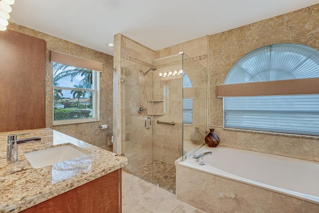full bath with toilet, a shower stall, a garden tub, and vanity