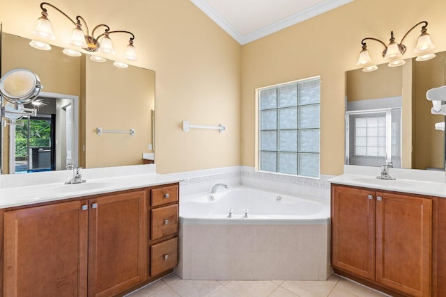 bathroom featuring crown molding, a sink, a garden tub, and two vanities