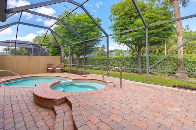 view of pool with a patio, a pool with connected hot tub, and glass enclosure