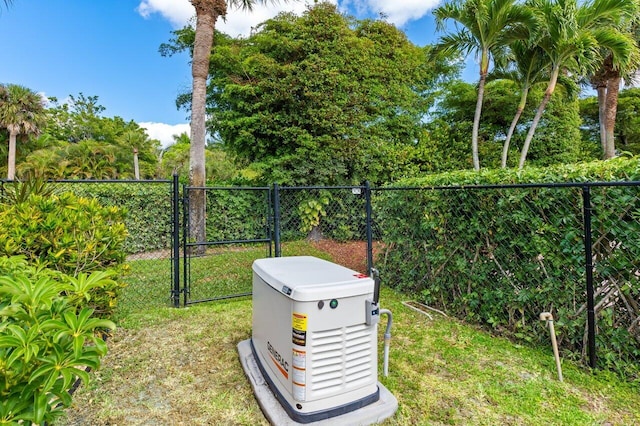 exterior details with fence, a gate, and a power unit