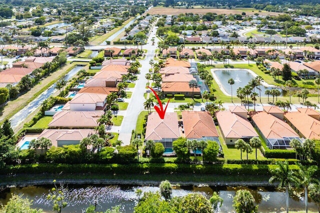 aerial view featuring a residential view and a water view