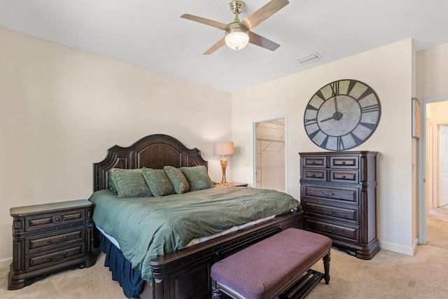 bedroom featuring baseboards, ceiling fan, light colored carpet, and visible vents