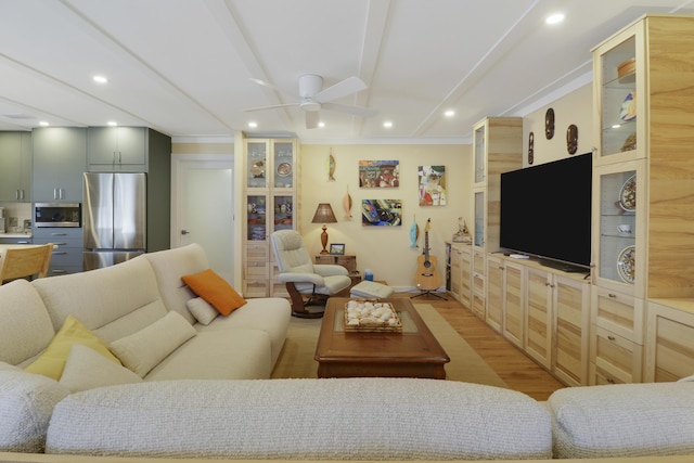 living room featuring a ceiling fan, recessed lighting, and light wood-style floors