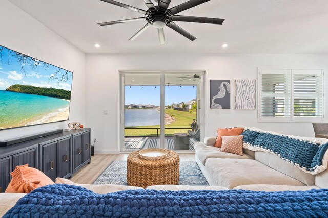 14175 SW Harker St, Port Saint Lucie, FL 34987 - living area featuring light wood-type flooring, a ceiling fan, and recessed lighting