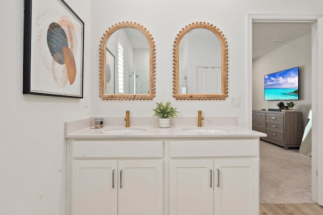 14175 SW Harker St, Port Saint Lucie, FL 34987 - full bath featuring double vanity and wood finished floors