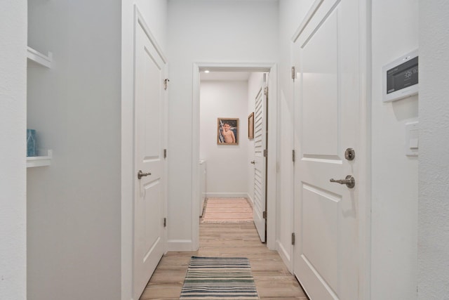 14175 SW Harker St, Port Saint Lucie, FL 34987 - corridor featuring light wood-style floors