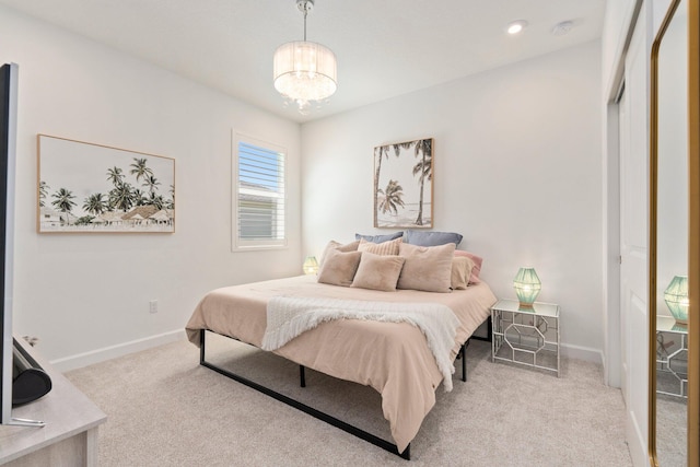 14175 SW Harker St, Port Saint Lucie, FL 34987 - carpeted bedroom featuring baseboards and a chandelier