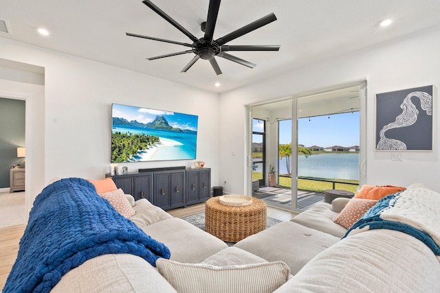 14175 SW Harker St, Port Saint Lucie, FL 34987 - living room with light wood finished floors, recessed lighting, and a ceiling fan
